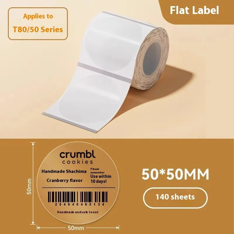 Roll of transparent waterproof adhesive labels showing rectangular and round sizes on thermal synthetic paper.