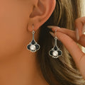A pair of silver retro fashion earrings for women with an electroplated alloy construction.