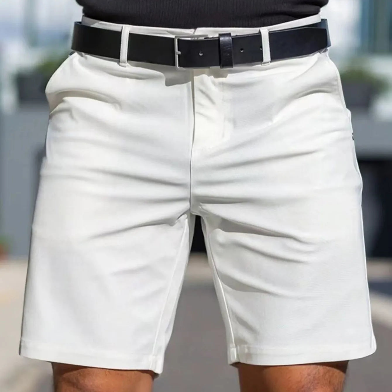 Man wearing straight-leg micro-elastic polyester fifth pants shorts in a choice of nine colours.