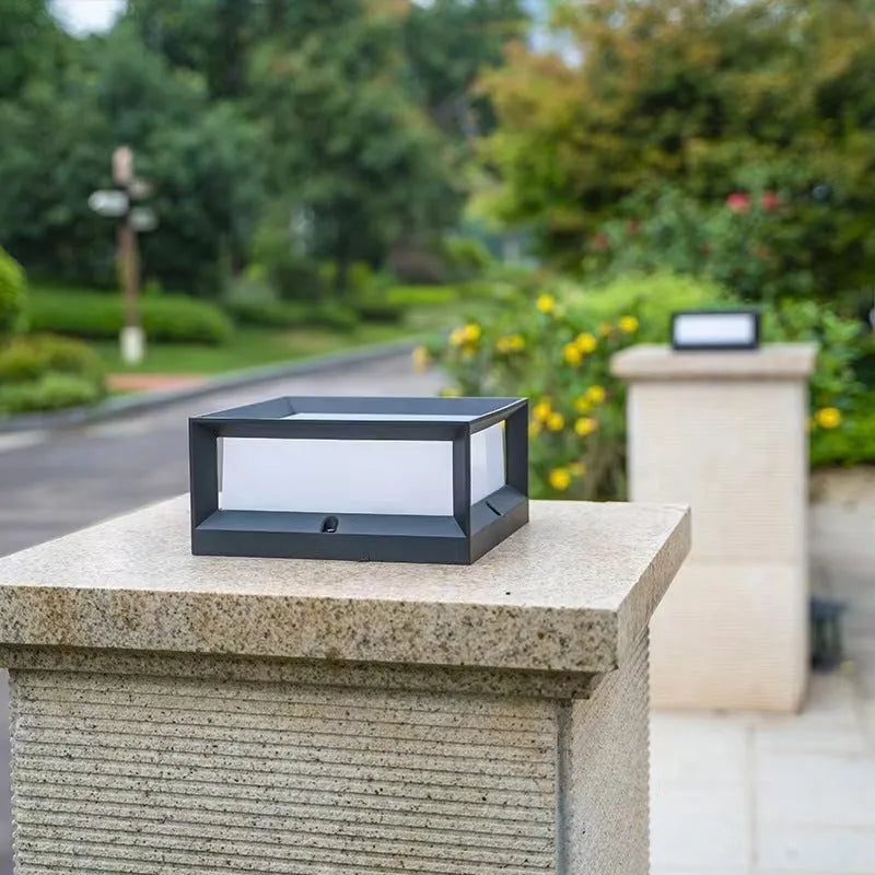 Silver aluminium solar-powered LED column light for outdoor wall mounting.
