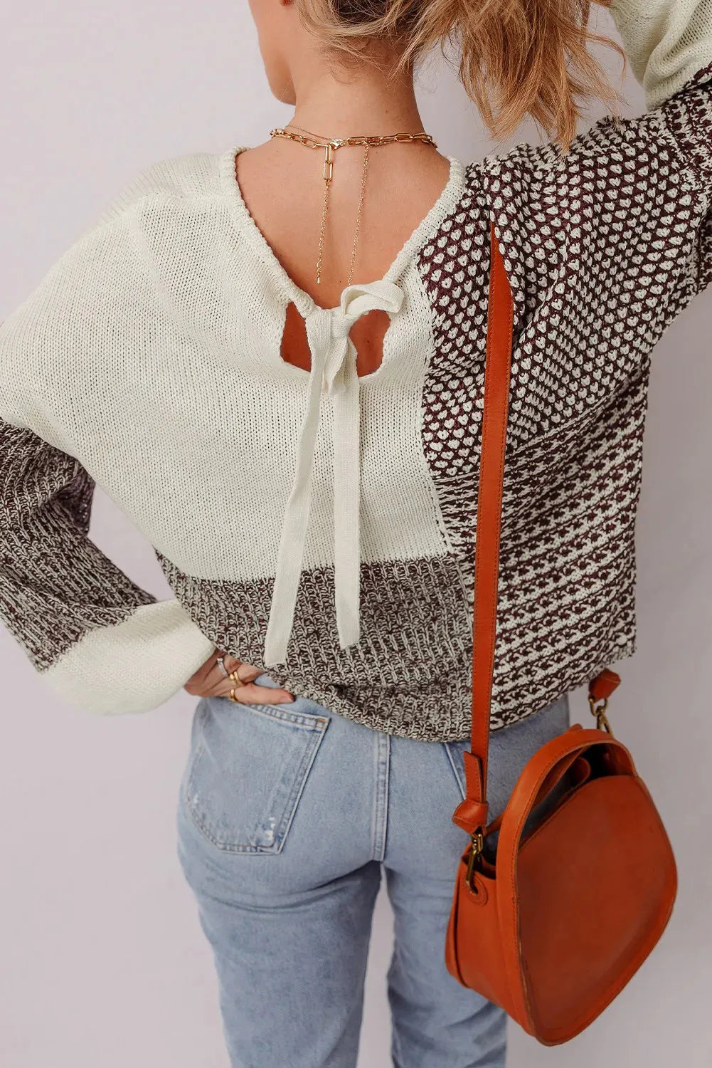 Dark khaki loose sweater with back tie detail and drop shoulder design