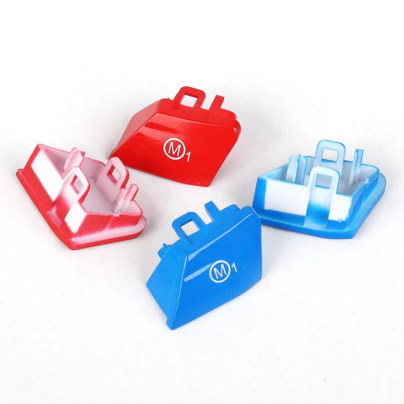 Pair of red and blue BMW M1 M2 steering wheel mode buttons with installation keys on a plain background.