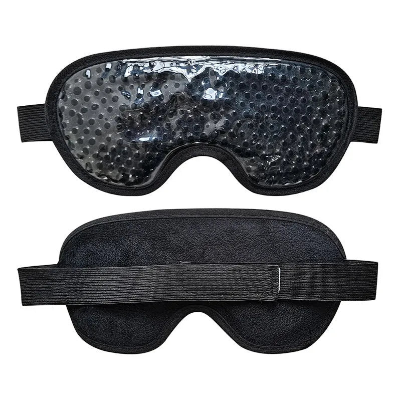 White portable rechargeable eye compress device with included eye mask on a grey background