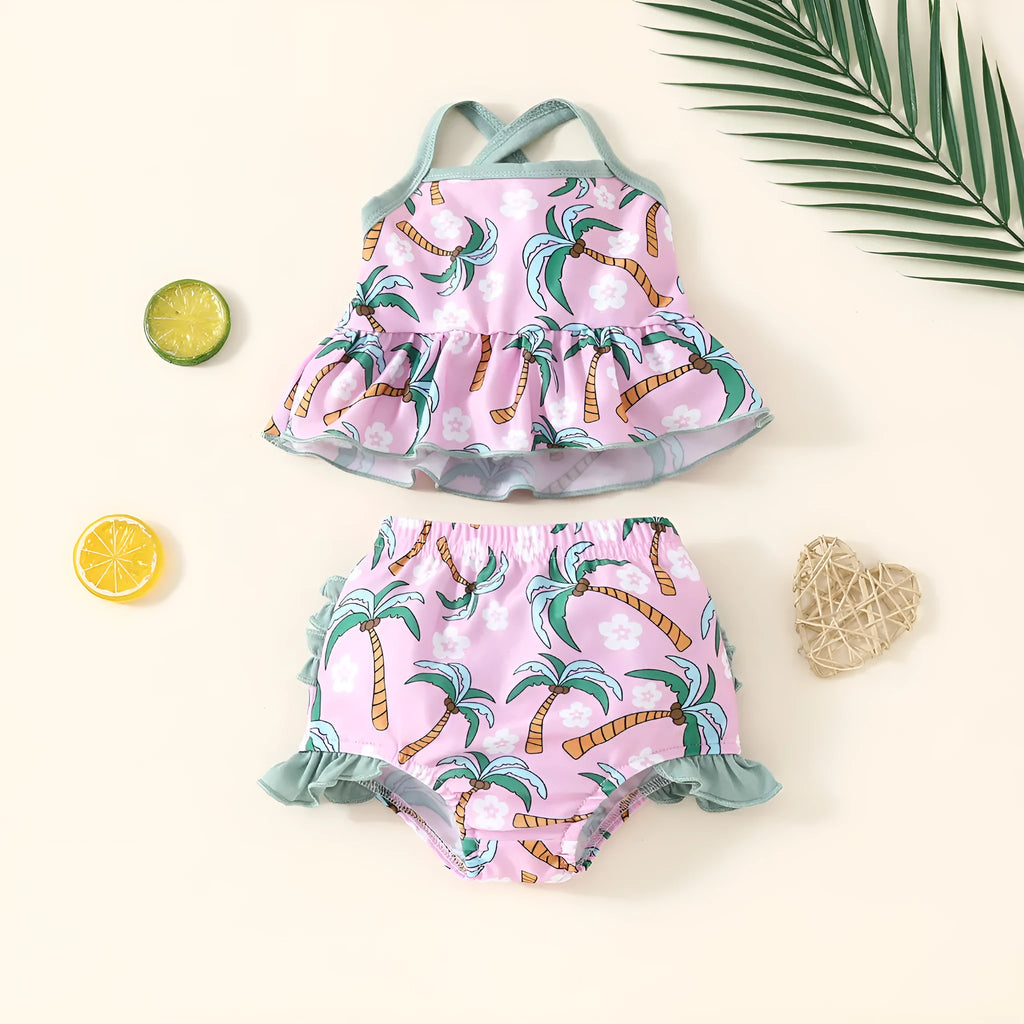 A white kids' two-piece swimsuit set consisting of a shirt and shorts, laid flat.