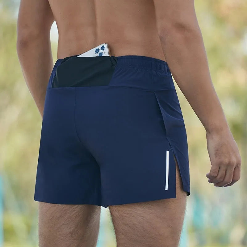 Men's loose-fitting off-road running shorts in black, shown for marathon and cross-country training