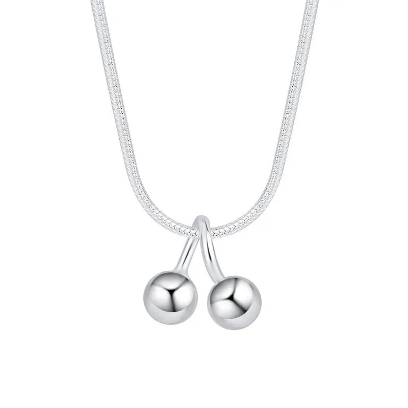Sterling silver cherry pendant necklace on a snake bone chain, adjustable from 21cm to 50cm.