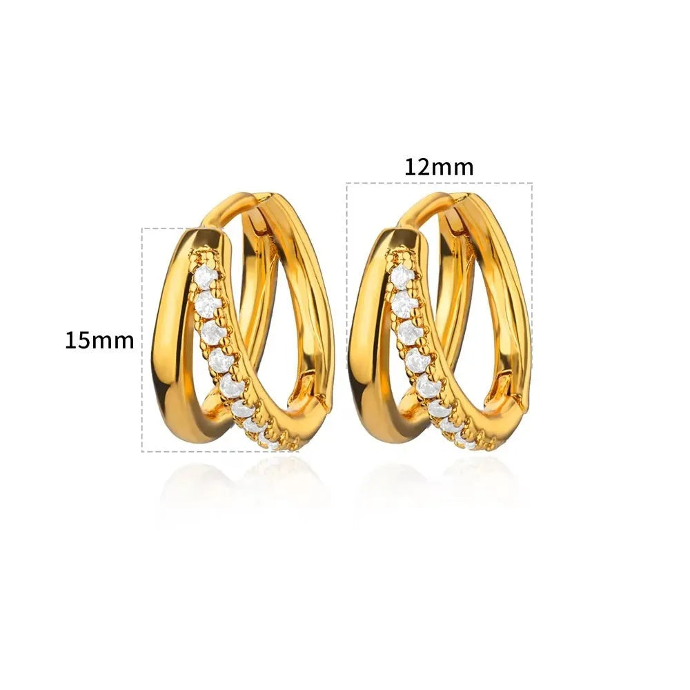 Geometric butterfly-shaped earrings with heart, bow, and star details in copper with a diamond-cut finish.