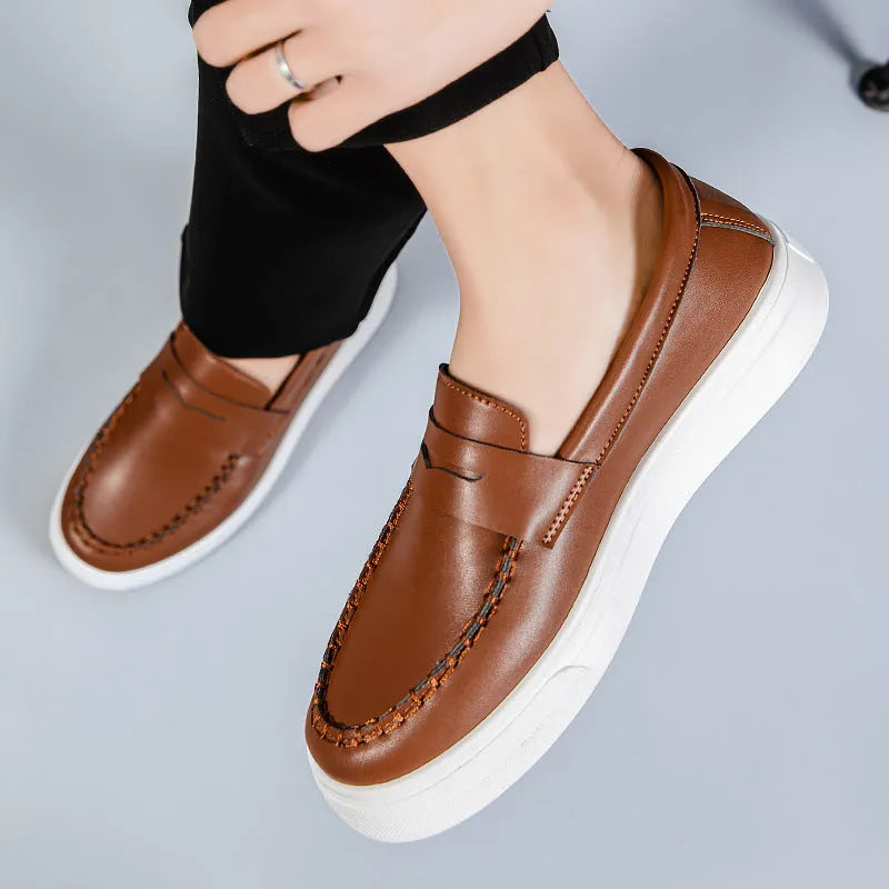 PU leather casual slip-on shoes in round toe design available in white, black and white, and khaki colour options