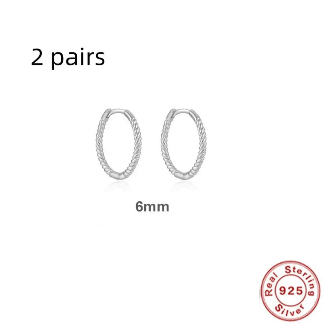 Sterling silver twisted hoop earrings with geometric round shape in gold electroplated finish