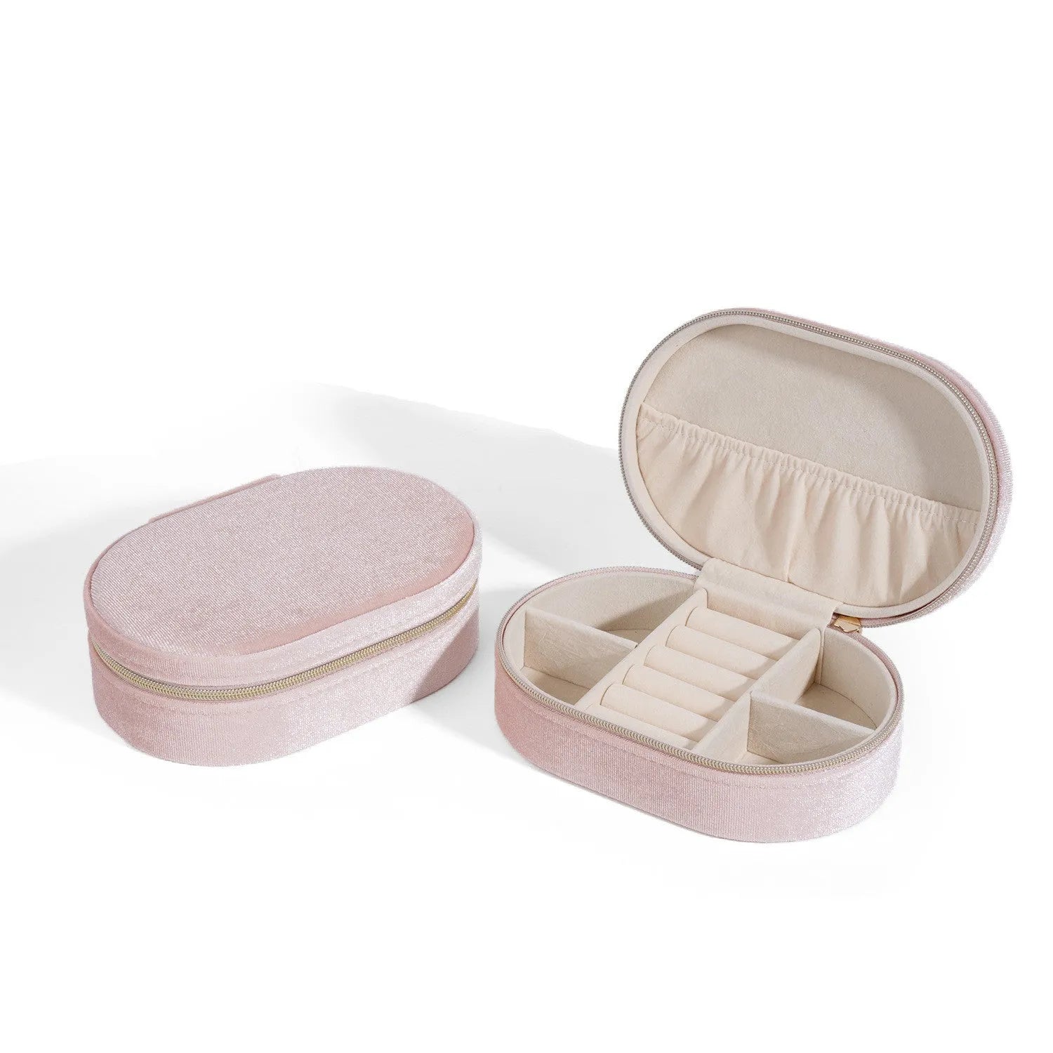 Oval velvet jewellery storage box in lake blue colour showing flannel interior and compact 15x10x5cm dimensions