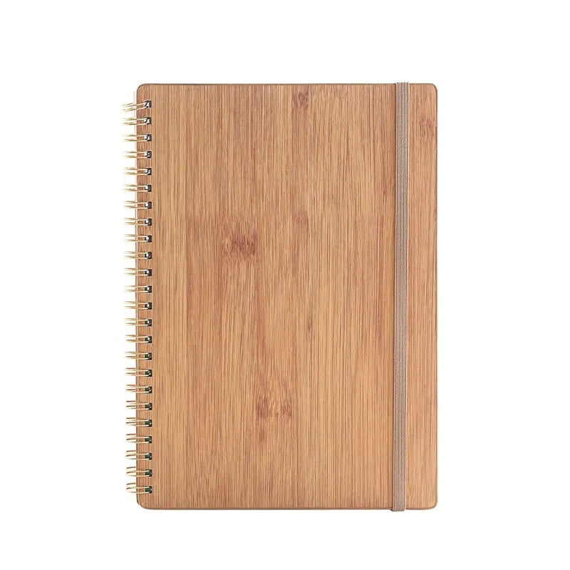 A5 erasable coil notebook with stone paper and pen on wooden surface