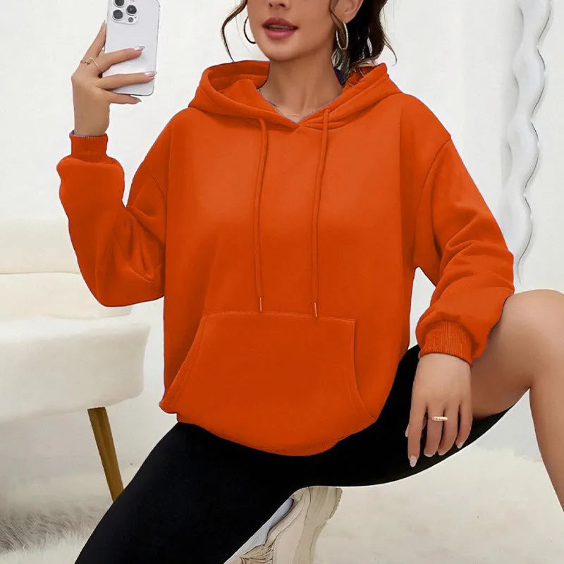 Women's loose fit grey sweatshirt with drawstring hood and kangaroo pocket