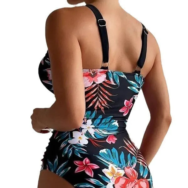 Women's floral print backless one-piece swimsuit on a mannequin.
