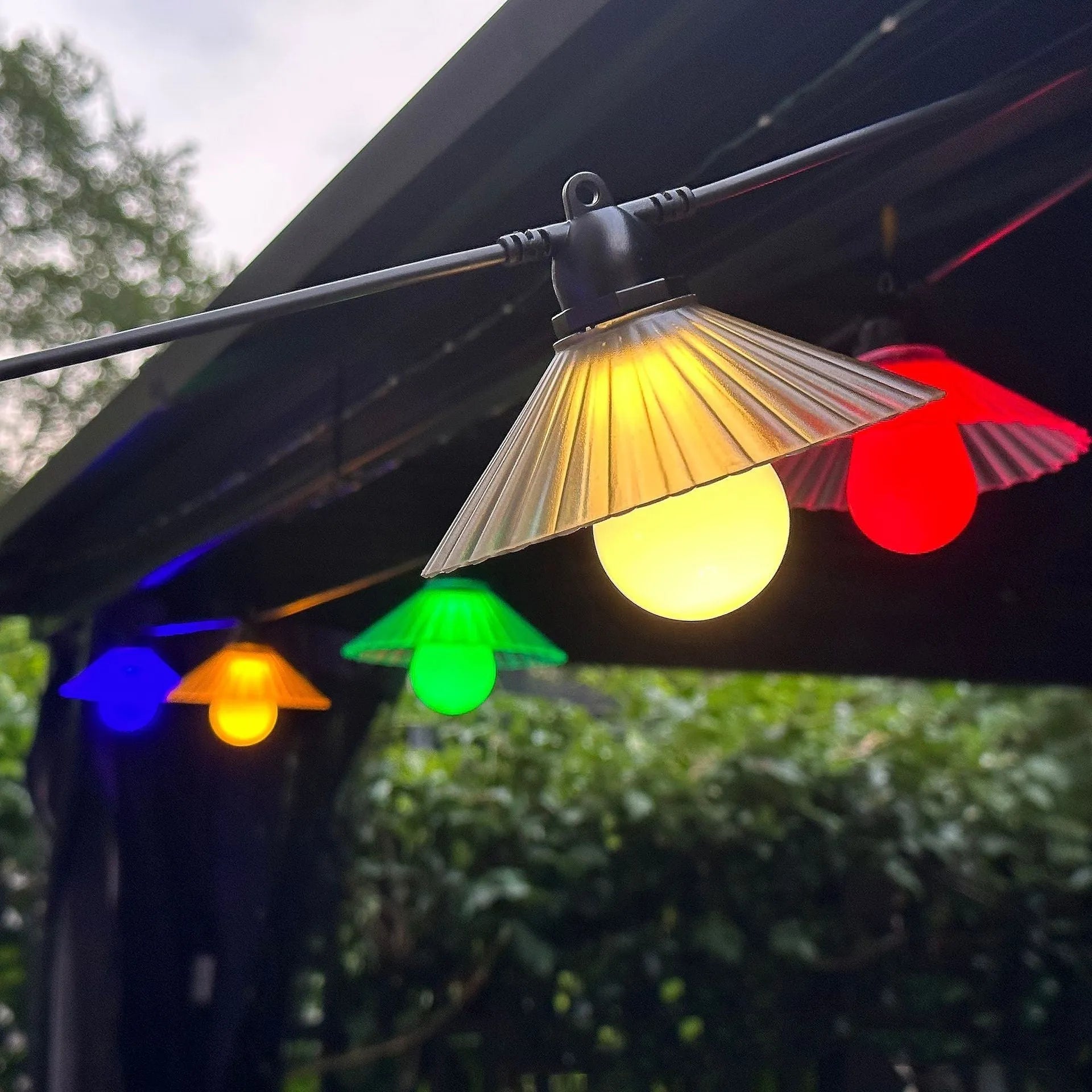 Outdoor waterproof LED string lights with flower-shaped globes in warm white and multi-colour options.