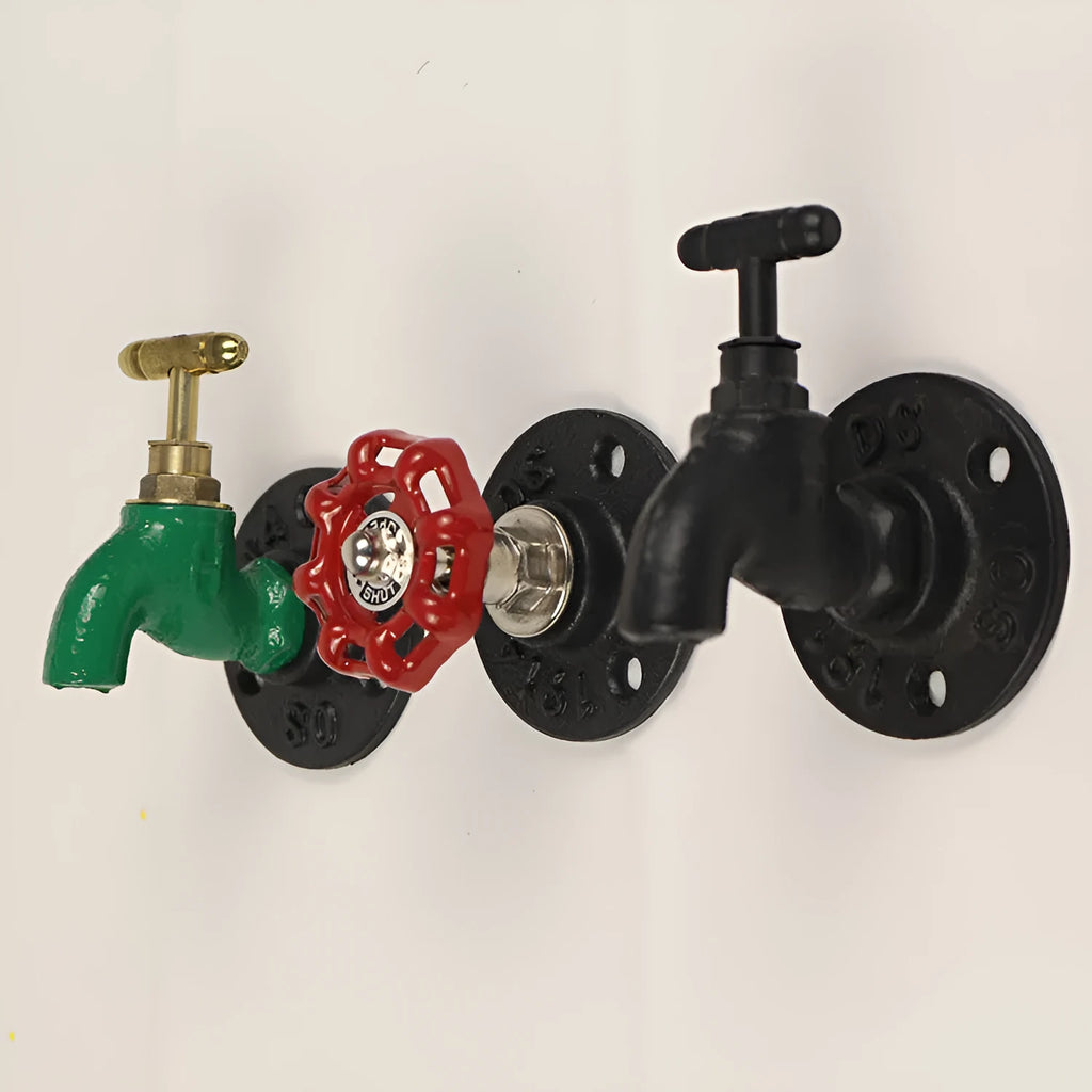 Metal wall-mounted towel rack hook designed like a water pipe, in a polished finish.
