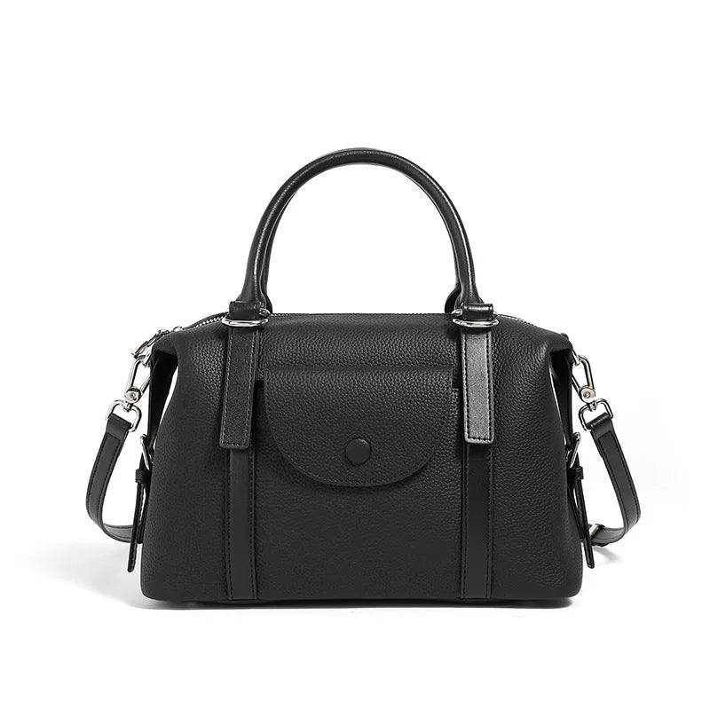 Genuine leather ladies handbag with contrast stitching and lock detail in street style