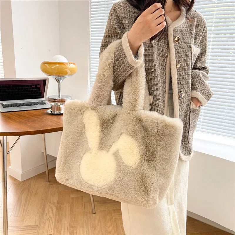Plush shoulder bag with cartoon rabbit ears detail in solid colour