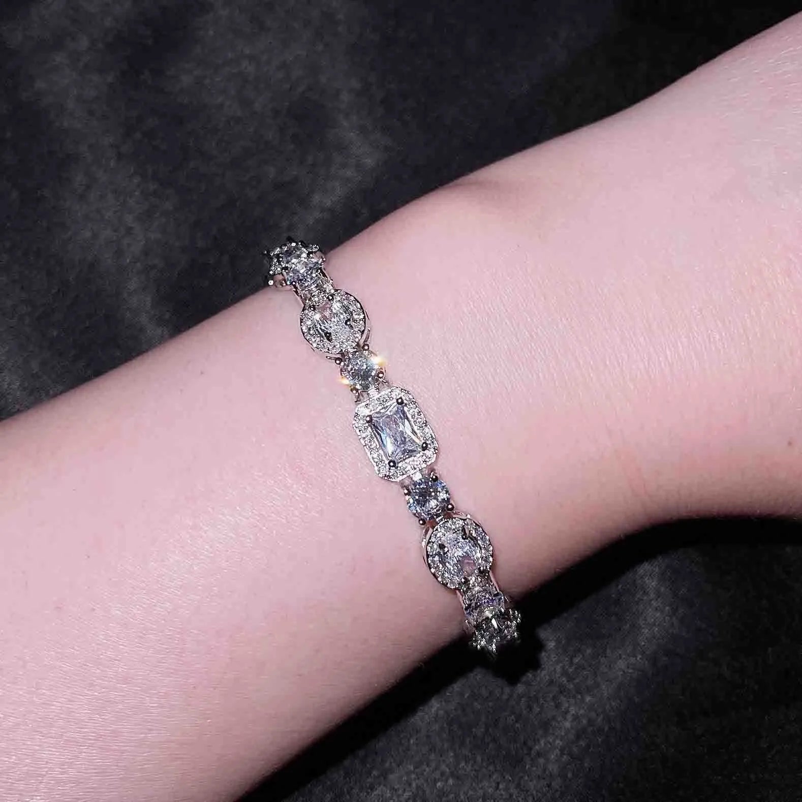 Women's sterling silver-plated bracelet with zircon stones in geometry design, shown in two size options