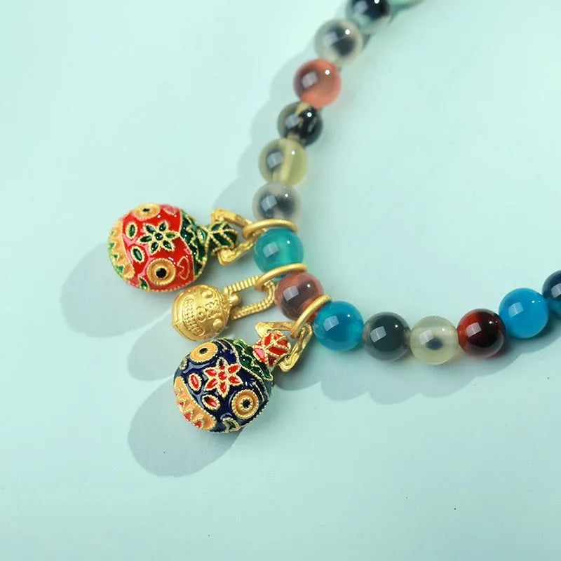 Natural agate women's bracelet with colourful sugar heart designs and geometric snake chain closure