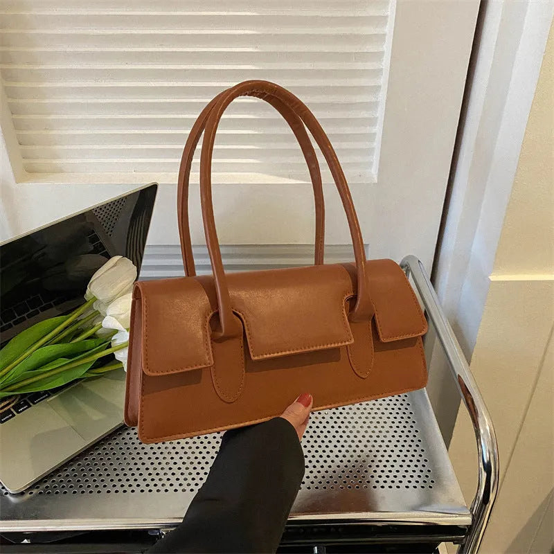 Women's black PU leather square shoulder bag with single strap and stitching detail