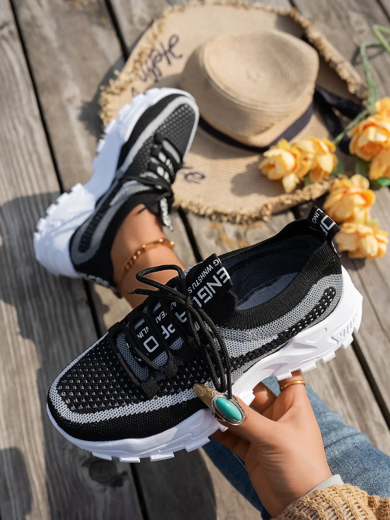 Women's Flyknit lace-up sneakers in a selected colour with a low rubber sole and round toe