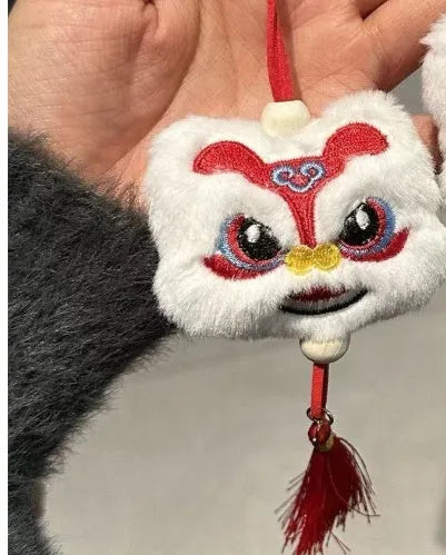 Chinese style plush lion tassel keychain ornament with star stone detail in blue or yellow