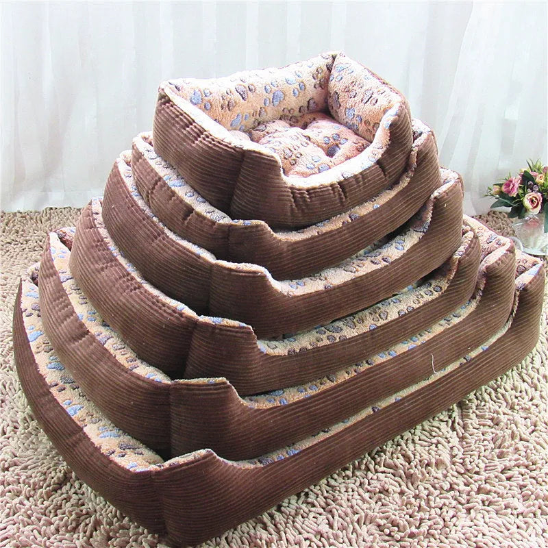 Soft beige plush dog bed with raised sides in a sofa-style design for small pets.