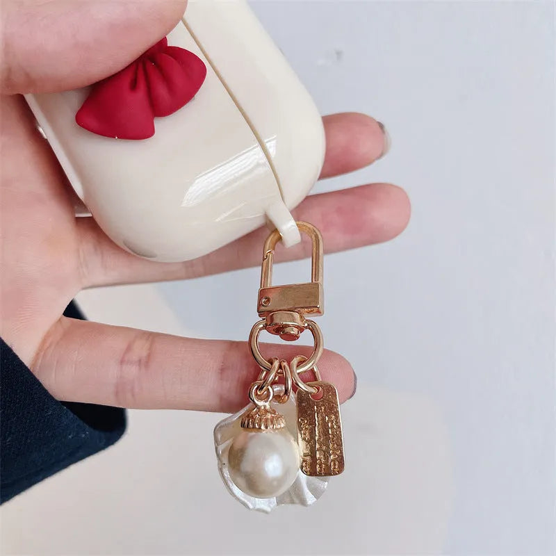 Beige red bow shell pendant wireless earphone case for AirPods Pro in TPU clamshell design