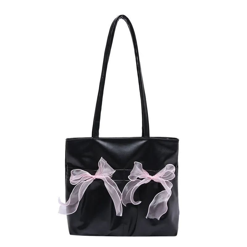 College style large capacity black tote bag with bow detail and double shoulder straps.
