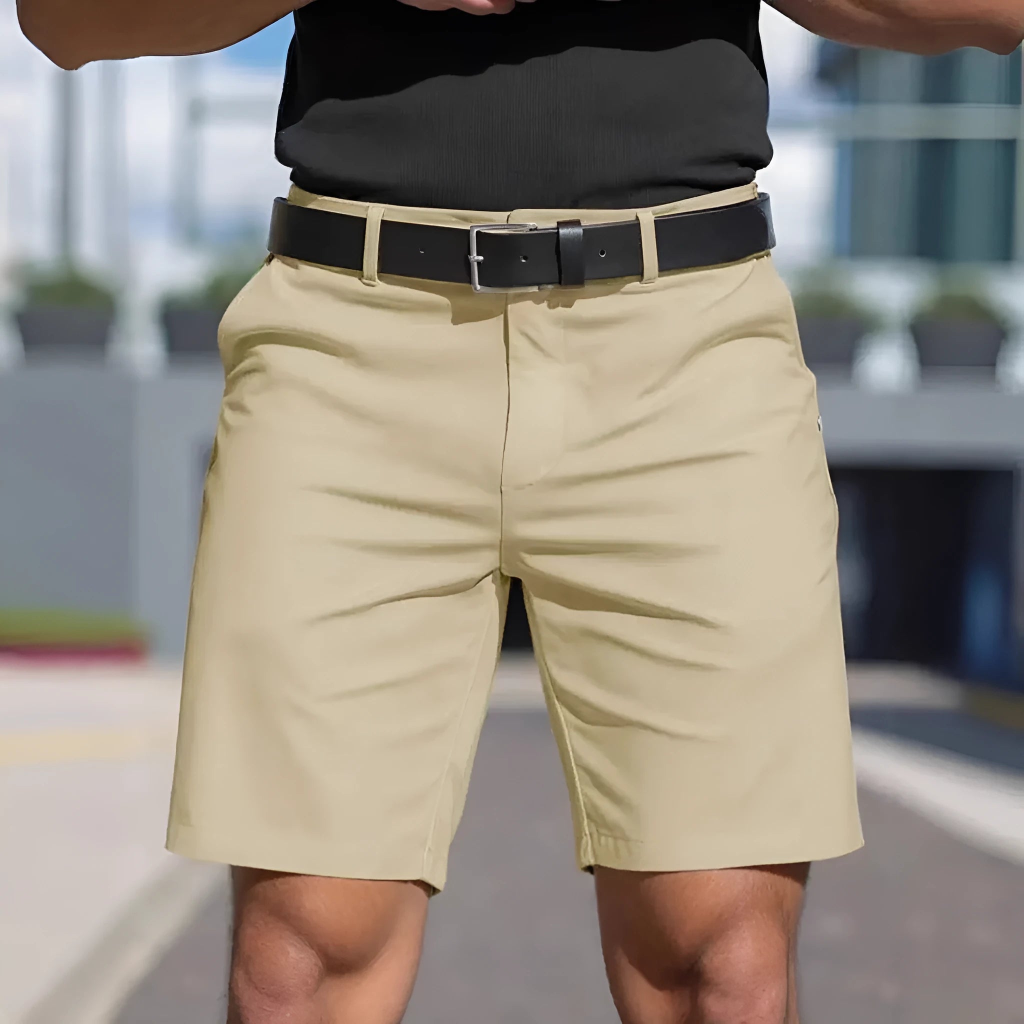 Man wearing straight-leg micro-elastic polyester fifth pants shorts in a choice of nine colours.