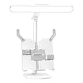 Adjustable desk lamp with integrated bookshelf showing three light colour settings and a charging cable.