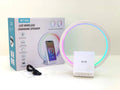 White Bluetooth speaker with wireless charging surface and ambient lighting