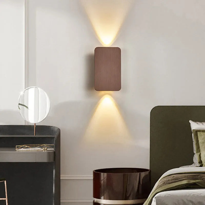 Minimalist Nordic-style LED wall lamp in black finish, mounted on a wall, showing clean lines and modern design.