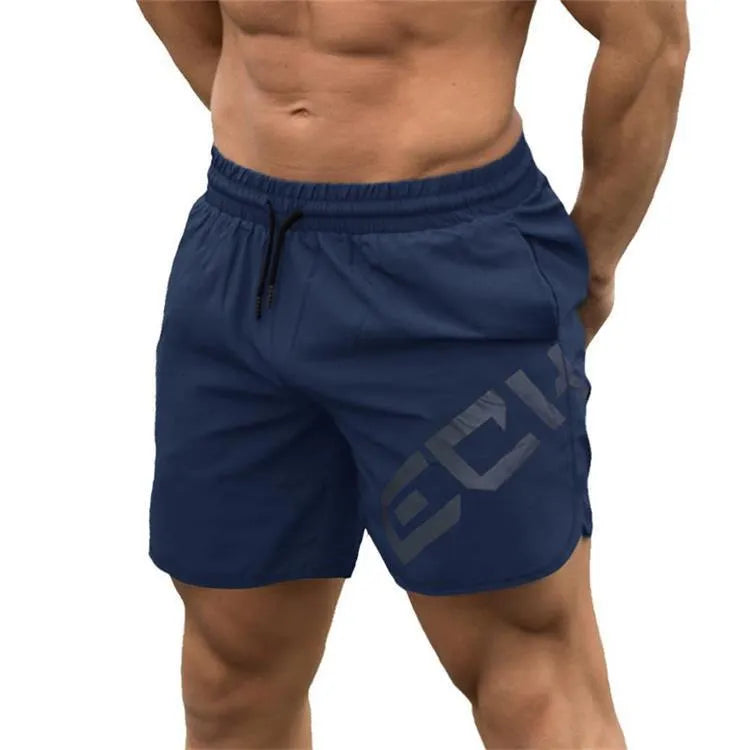 Men's black elastic training shorts with a knee-length cut on a plain background.