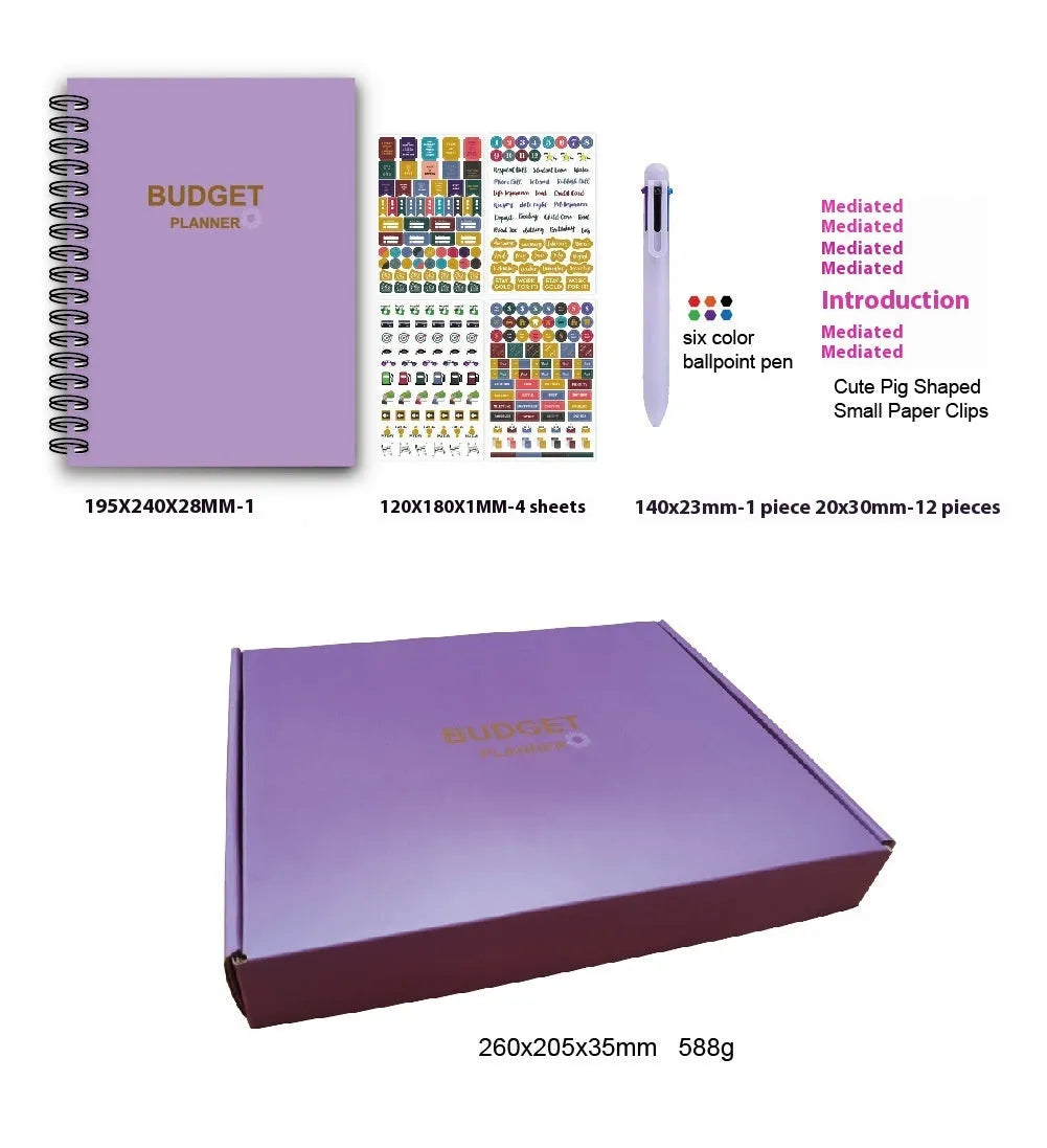 Purple coil-bound budget book open showing monthly financial planning layout with stickers and paper clips