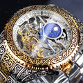 Yellow Forsining skeleton tourbillon mechanical watch with stainless steel band on wrist