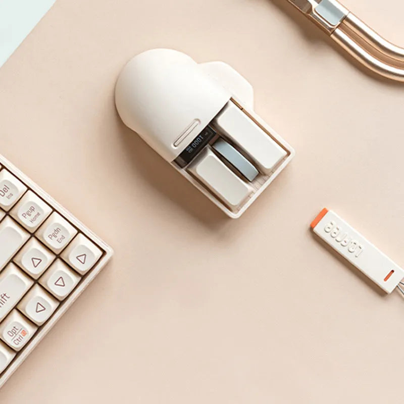 Xiaoqiao Tofu coloured wireless mouse with seven buttons and four way roller on mouse pad