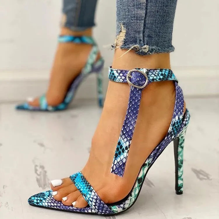 Blue serpentine style women's high heels with buckle fastening and hollow out detail