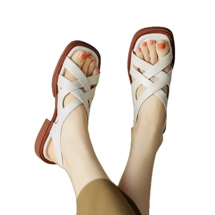 Women's patent leather square toe sandals with cross straps in black colour