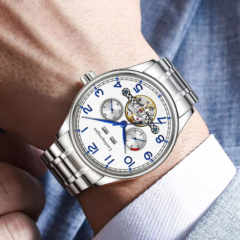 Men's stainless steel business watch with leather strap and sapphire glass, showing transparent case back.