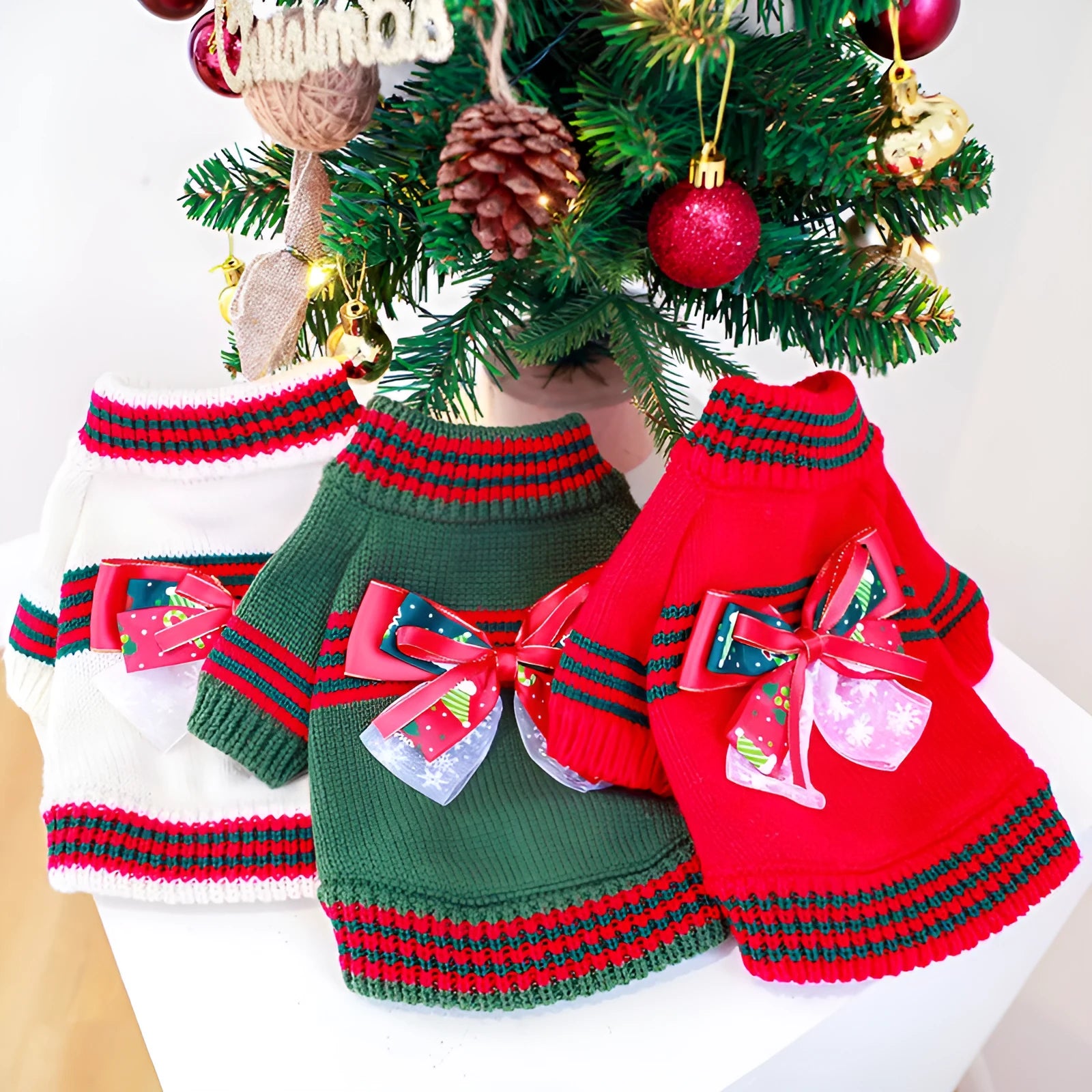 Green Christmas pet sweater for a small dog on a festive background.