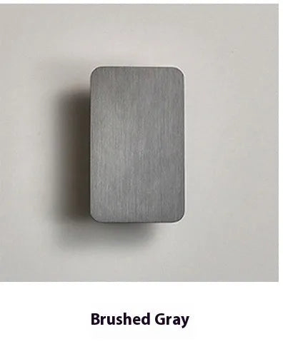 Minimalist Nordic-style LED wall lamp in black finish, mounted on a wall, showing clean lines and modern design.