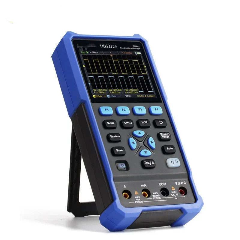 Handheld digital oscilloscope with probe on workbench for automotive electrical testing