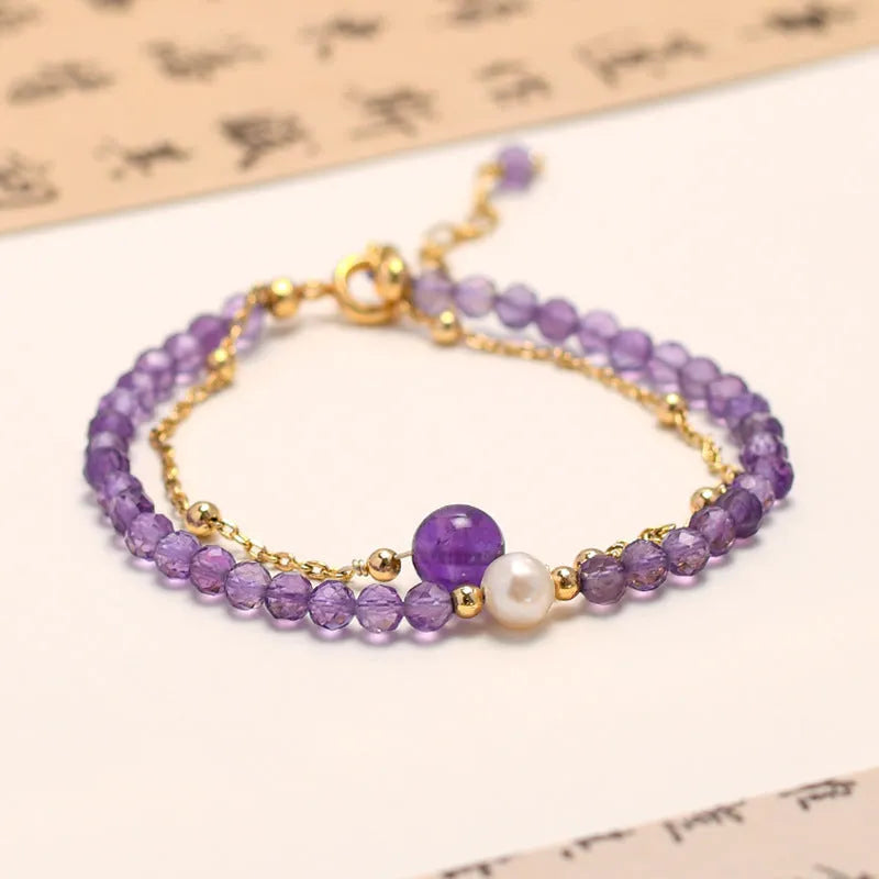 Chinese style women's bracelet with amethyst diamond-shaped crystals and electroplated finish.