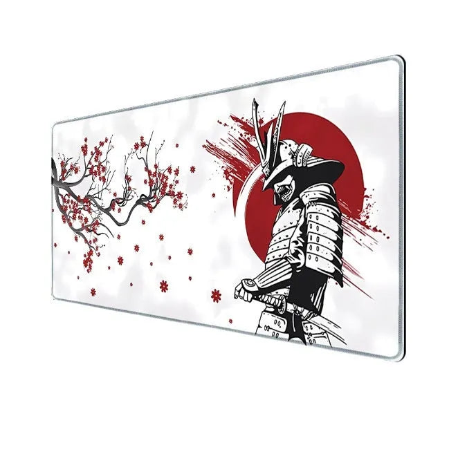 Japanese Samurai design cloth gaming mouse pad with non-slip base on a desk.
