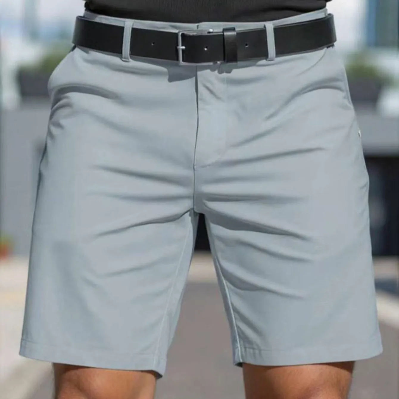 Man wearing straight-leg micro-elastic polyester fifth pants shorts in a choice of nine colours.