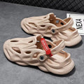 Men's grey coconut slippers with closed toe design and EVA construction on wooden deck