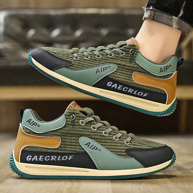 Men's lightweight mesh running shoe in green or grey with lace-up front and round toe