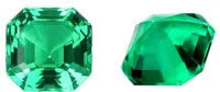 Loose cultivated emerald gemstone in Columbia green colour showing round and fancy cut shapes on a white background.