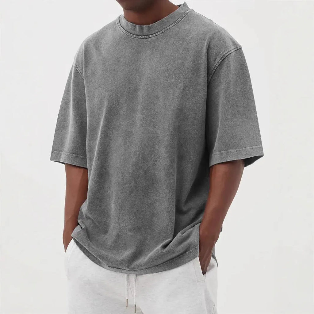 Men's loose fit distressed pullover t-shirt in stone washed polyester showing half sleeve design